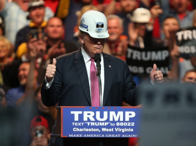 CHARLESTON, WV - MAY 05: Republican Presidential candidate Donald Trump models a hard hat in support of the miners during his rally at the Charleston Civic Center on May 5, 2016 in Charleston, West Virginia. Trump became the Republican presumptive nominee following his landslide win in indiana on Tuesday.(Photo by …