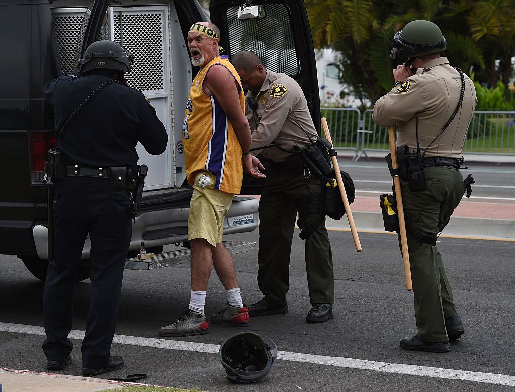 An anti-Trump protesters is arrested after clashes with police during a rally outside Republican presidential candidate Donald Trump's event in San Diego, California, on May 27, 2016. / AFP / Mark Ralston (Photo credit should read MARK RALSTON/AFP/Getty Images)