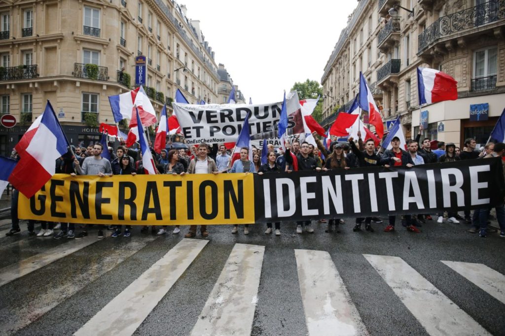 Protesters from far-right movement Generation Identitaire take part in a demonstration against migrants on May 28, 2016 in Paris. / AFP / MATTHIEU ALEXANDRE (Photo credit should read MATTHIEU ALEXANDRE/AFP/Getty Images)