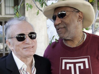 Hefner and Cosby (Reed Saxon / Associated Press)