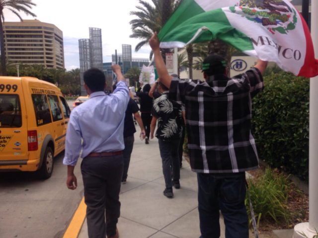 Latinos protest Donald Trump with Mexican flag (Adelle Nazarian / Breitbart News)