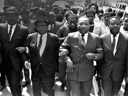 The Rev. Ralph Abernathy, right, and Bishop Julian Smith, left, flank Dr. Martin Luther King, Jr., during a civil rights march in Memphis, Tenn., March 28, 1968. (AP Photo/Jack Thornell)
