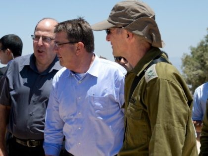 From left, Israel Defense Forces (IDF) 91st Division Commander Moni Katz, directing his right arm forward, Israeli Defense Minister Moshe Ya'alon, U.S. Defense Secretary Ash Carter and Deputy Chief of Staff Maj. Gen. Yair Golan pause as they walk from viewing Hula Valley from the Hussein Lookout, behind them, near …