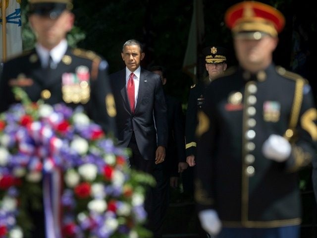 President Barack Obama, center, arrives with Maj. Gen. Bradley A. Becker, right, for the w