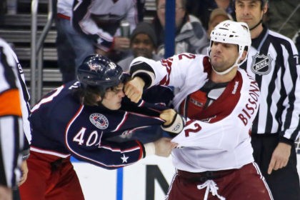 COLUMBUS, OH -MARCH 16: Paul Bissonnette #12 of the Phoenix Coyotes punches Jared Boll #4