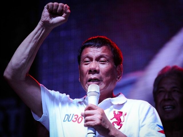Philippine presidential candidate Rodrigo Duterte gestures during a labor day campaign ral
