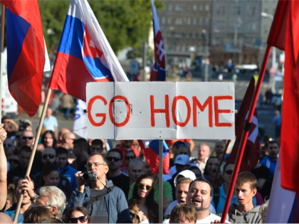 Participants hold flags and a banner during an anti-immigration rally organised by an initiative called 'Stop Islamisation of Europe' and backed by the far-right 'People's Party-Our Slovakia' on September 12, 2015 in Bratislava, Slovakia. / AFP / SAMUEL KUBANI (Photo credit should read SAMUEL KUBANI/AFP/Getty Images)