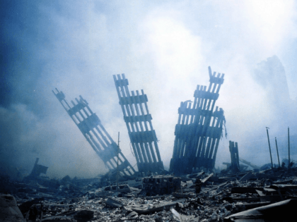 The rubble of the World Trade Center smoulders following a terrorist attack 11 September 2001 in New York.