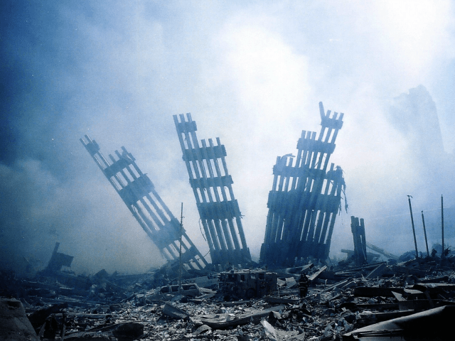 The rubble of the World Trade Center smoulders following a terrorist attack 11 September 2