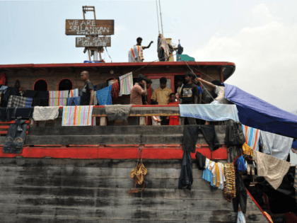 Sri Lankan asylum seekers stay on their boat moored at Merak seaport in Serang District on