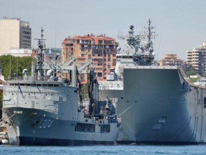 HMAS Canberra (R), the Royal Australian Navy's latest warship, is berthed at Garden I