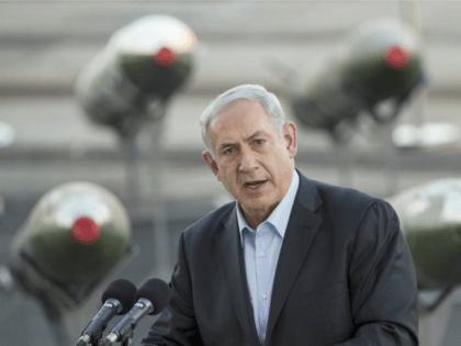Israeli Prime Minister Benjamin Netanyahu speaks to the press at southern Israeli port of Eilat, on March 10, 2014, as Israel displayed advanced rockets type M-302 that were unloaded from the Panamanian-flagged Klos-C vessel on March 9, 2014 in Eilat.