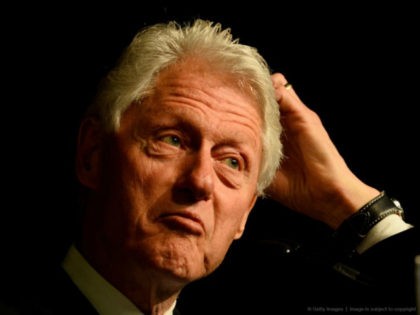 Former US President Bill Clinton speaks during a campaign rally for his wife, Democratic P