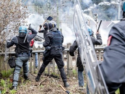 BRENNER, AUSTRIA - MAY 07: Riot police clash with protesters during a rally against the Au