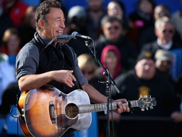 Rocker Bruce Springsteen performs during a rally for President Barack Obama on the last da