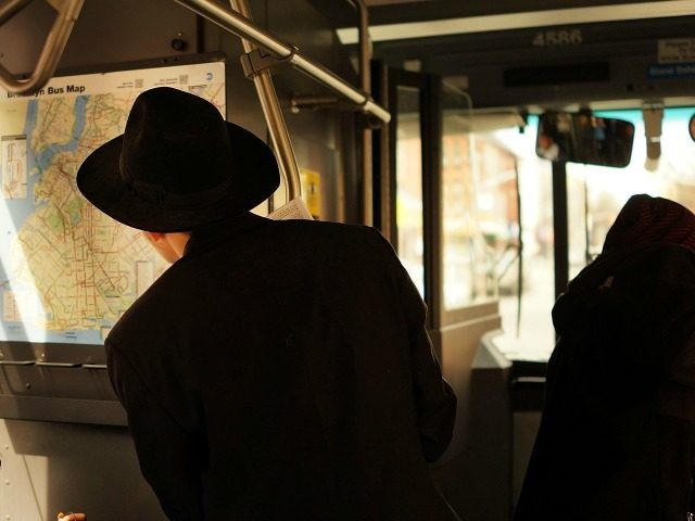 A man looks at the map for the B46 bus on April 8, 2014 in the Brooklyn borough of New Yor