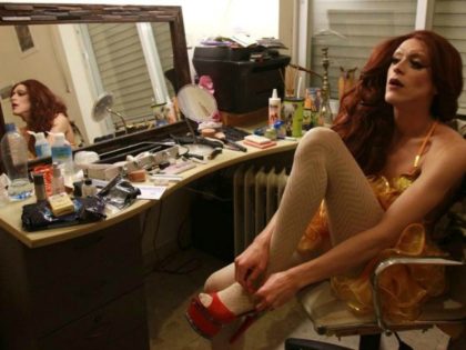 Israeli drag queen Yossale gets dressed at the family home in Jerusalem before performing at the "Video" bar outside the Old City