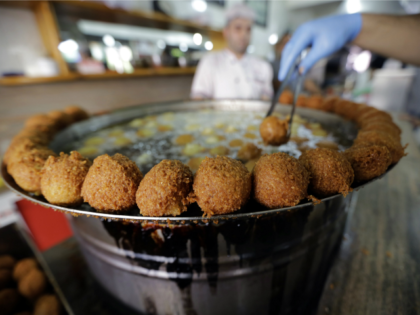 A cook fries Falafel balls at a restaurant in Jounieh, north of the Lebanese capital Beiru