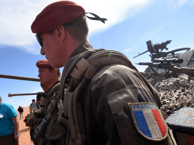 French soldiers stand guard in Madama near the border with Lybia on January 1, 2015.