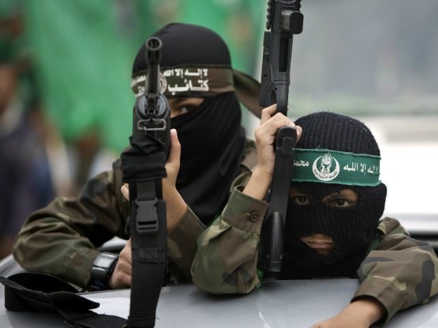Palestinian young jihad boys take part in a rally of Hamas supporters to commemorate the 27th anniversary of the Islamist movements creation and to ask for the reconstruction of the Gaza Strip on December 12, 2014 in Jabalia refugee camp in the northern Gaza Strip.
