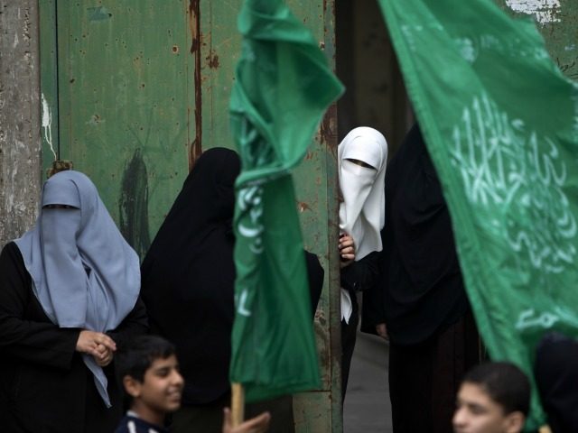 Palestinian women take part in a rally of Hamas supporters to commemorate the 27th anniversary of the Islamist movements creation and to ask for the reconstruction of the Gaza Strip on December 12, 2014 in Jabalia refugee camp in the northern Gaza Strip.