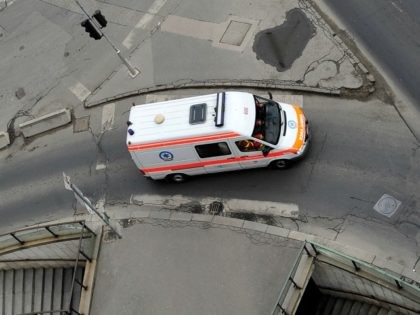 A rescue car driver maneuvers on a street of Budapest downtown on February 22, 2011.