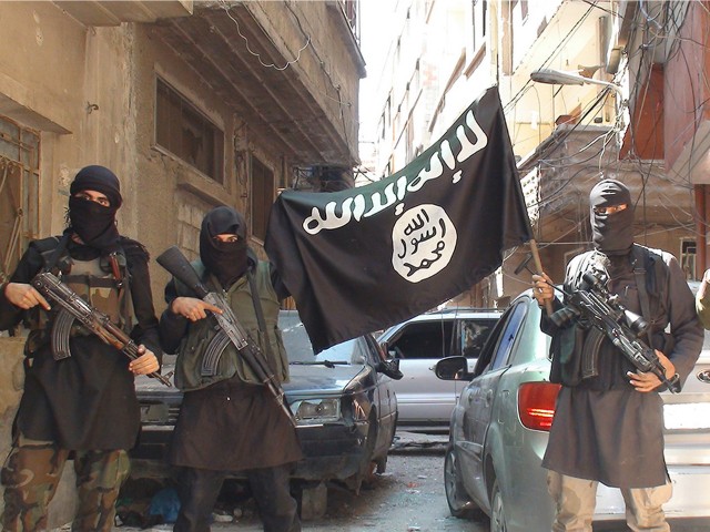 A photo posted on internet on April 7, 2015 shows ISIS or Daesh (Daech) or "Islamic State" group militants posing in Yarmouk (Yarmuk) Palestinian camp, located in a suburb of Damascus, Syria, that is partially now under their control. Photo by Balkis Press/Sipa USA (Sipa via AP Images)