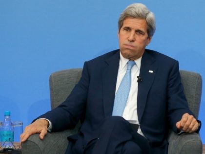 U.S. Secretary of State John Kerry listens during a panel discussion at the Anti-Corruptio