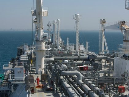 An employee walks on the Expedient regasification ship, anchored off the coast of Israel in the Mediterranean Sea on February 26, 2015, as natural gas began flowing from the vessel, hired by the Israel Electric Corporation, to its power stations.