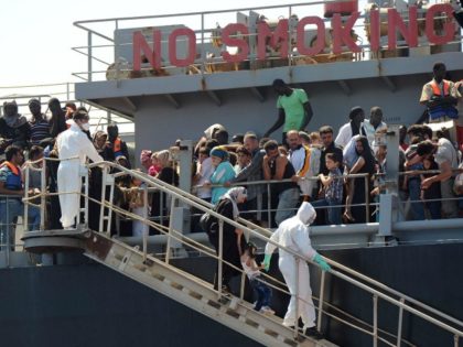 A picture taken at sea shows the transfer of immigrants from the tanker 'Torm Lotte&#