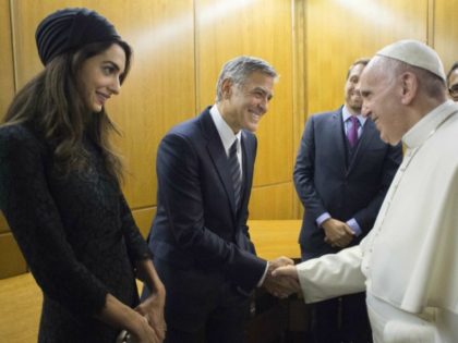 Pope Francis meets George Clooney and his wife Amal at the Vatican meeting (L'Osservatore Romano/Pool photo via AP)