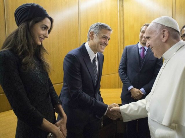 Pope Francis meets George Clooney and his wife Amal at the Vatican meeting (L'Osserva