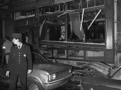 A police officer is held on the spot of the attack perpetre on October 3, 1980 against the synagogue of the street Copernic in Paris, which made four victims and blesse 20 people. With police force officer stands amid bus wreckage after bomb exploded 03 October 1980 has at the …