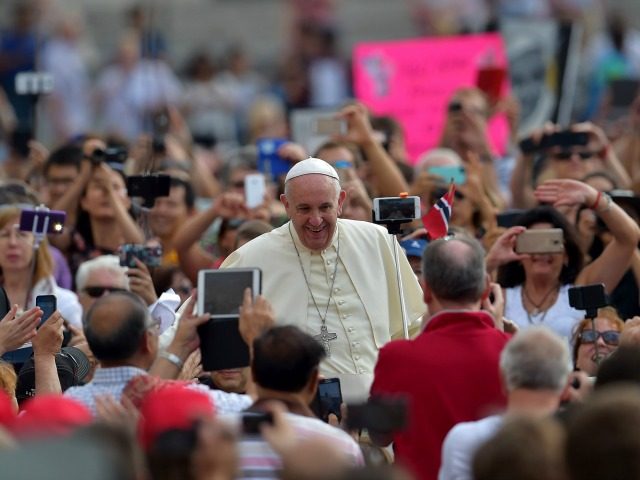 Pope Francis waves to faithful upon his arrival on St Peter's square at the Vatican t