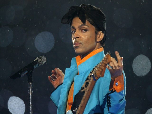 Prince performs during the halftime show of the NFL's Super Bowl XLI football game between