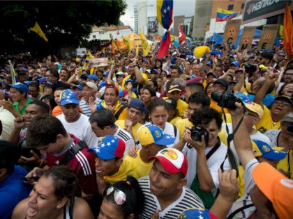 People chant against the government of President Nicolas Maduro during a march in Caracas,