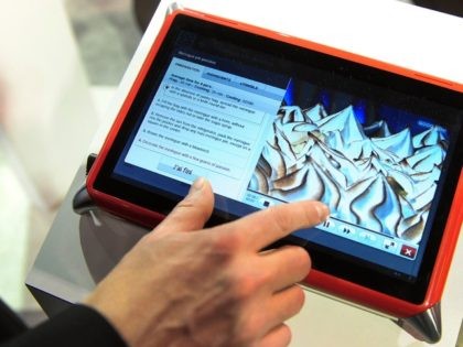 Guillame Hepp of Qooq-Unowhy gives a demonstration of the Qooq Cooking Tablet, a water-res