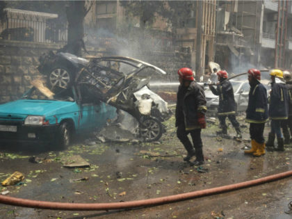 SYRIA, ALEPPO : Syrian emergency personnel secure a street after rockets reportedly fired by rebels hit Al-Dabbeet hospital in the government-controlled neighbourhood of Muhafaza in the northern city of Aleppo on May 3, 2016. The rebel fire on the hospital killed at least three women and wounded another 17 people, …