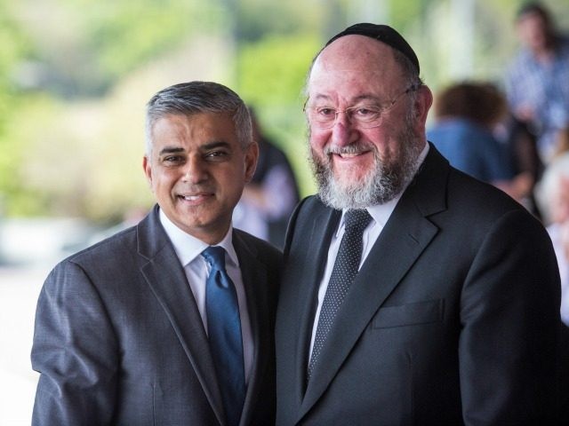 London Mayor Sadiq Khan (L) poses with Chief Rabbi Ephraim Mirvis (R) as they attend Yom HaShoah, the Jewish Community's Holocaust Remembrance Day, at the Barnet Copthall Stadium on May 8, 2016 in London, England.