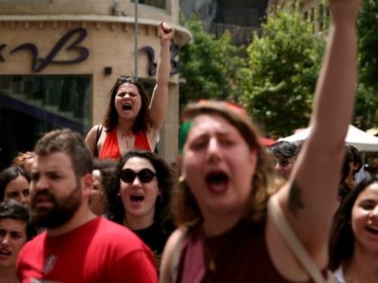 Israeli activists chant slogans during the 5th annual 'SlutWalk' march through central Jerusalem on May 13, 2016 to protest against rape culture, including sexual assault and harassment directed at women