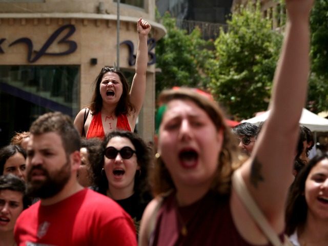 Israeli activists chant slogans during the 5th annual 'SlutWalk' march through c