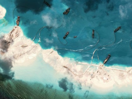 Dredgers deposit sand on the northern rim of the Mischief Reef, located 216 km (135 miles) west of the Philippine island of Palawan, in this Center for Strategic and International Studies (CSIS) Asia Maritime Transparency Initiative satellite image taken on February 1, 2015... REUTERS/CSIS'S ASIA MARITIME TRANSPARENCY INITIATIVE/DIGITAL GLOBE/HANDOUT