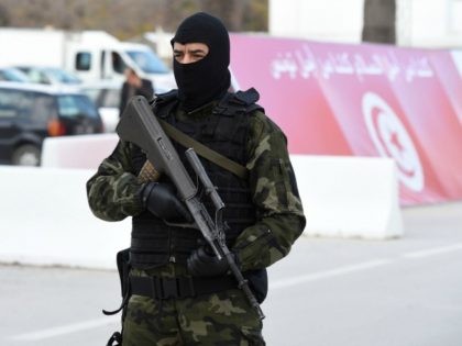 A member of the Tunisian security forces stands guard outside the Bardo museum in Tunis on