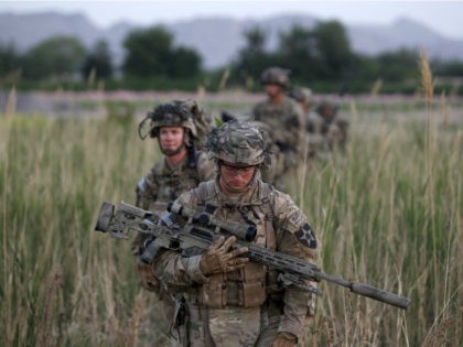 U.S. soldiers from 5-20 infantry Regiment attached to 82nd Airborne walk while on patrol i
