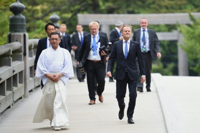 European Council President Donald Tusk (R) arrives at Ise-Jingu Shrine in the city of Ise