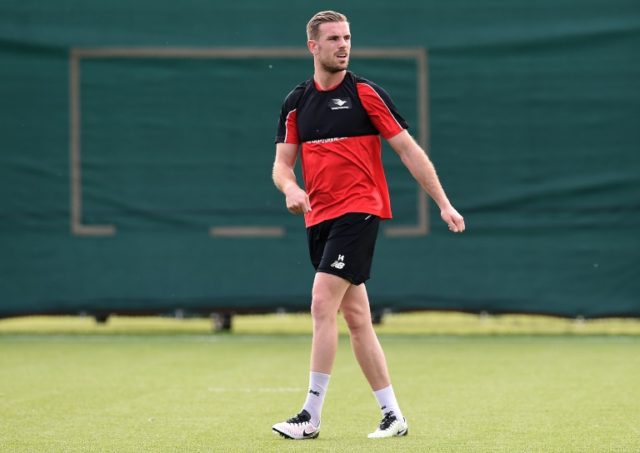 Liverpool's English midfielder Jordan Henderson participates in a training session at thei