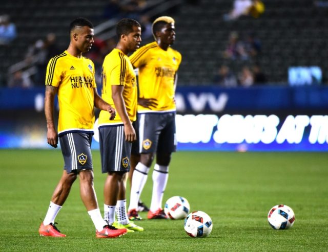 Los Angeles Galaxy's Ashley Cole, Giovani Dos Santos and Gyasi Zardes warm up before a mat
