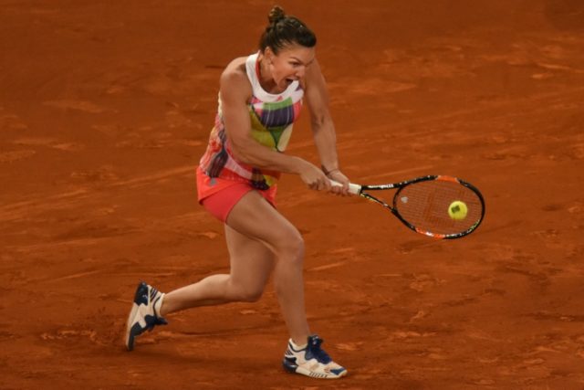 Romania's Simona Halep returns a ball to Slovakia's Dominika Cibulkova on May 7, 2016