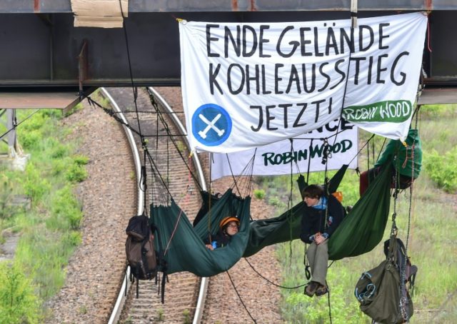 Environmental activists lie in hammocks near the coal-fired power Schwarze Pumpe station b
