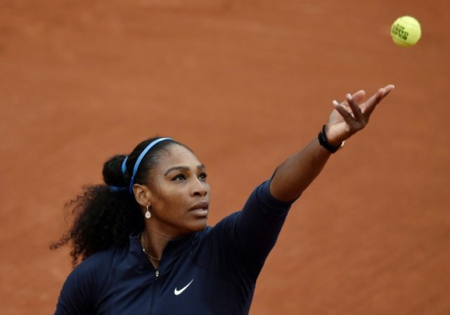 Serena Williams serves the ball to Magdalena Rybarikova during their women's first round m